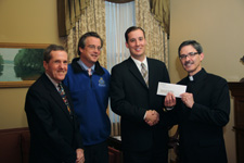The University of Scranton presented the city of Scranton with its annual voluntary contribution of $175,000 for 2011. The University’s voluntary contributions total more than $2.5 million since 1989. Standing, from left, are: City Council member Robert McGoff, Scranton Mayor Christopher Doherty, Scranton Business Administrator Ryan McGowan and University of Scranton President Kevin P. Quinn, S.J.